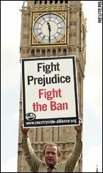 Protester holds 'Fights Prejudice, Fight the ban' banner outside the Palace of Westminster. Reuters