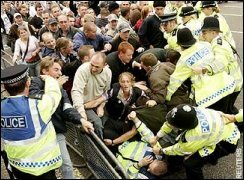 Scuffles erupt as some protesters push forward towards police blockades. Reuters.